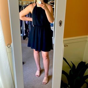 Silky black dress with adorable cut out on back.